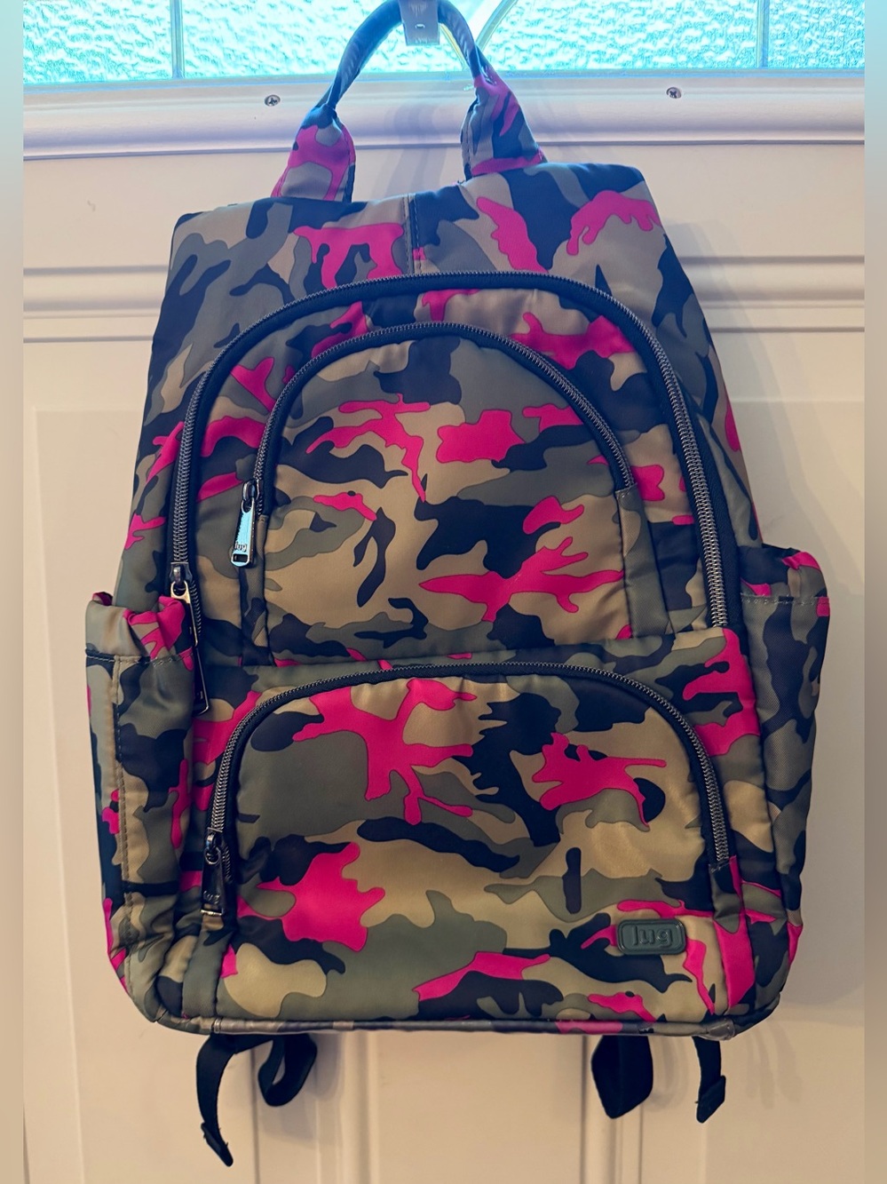 Lug Hatchback Backpack in a Camo Pink Pattern